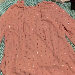 A pink and gold shirt